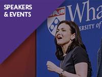 Person speaking at an event with a backdrop featuring the Wharton School logo. The words "Speakers & Events" appear in a purple banner.